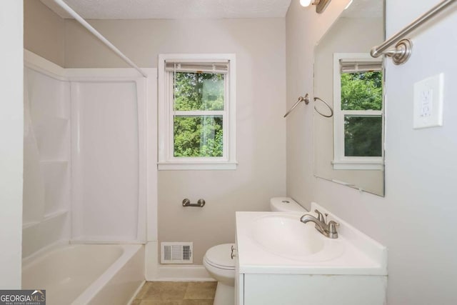 full bathroom featuring tile patterned flooring, toilet, shower / bath combination, vanity, and a textured ceiling