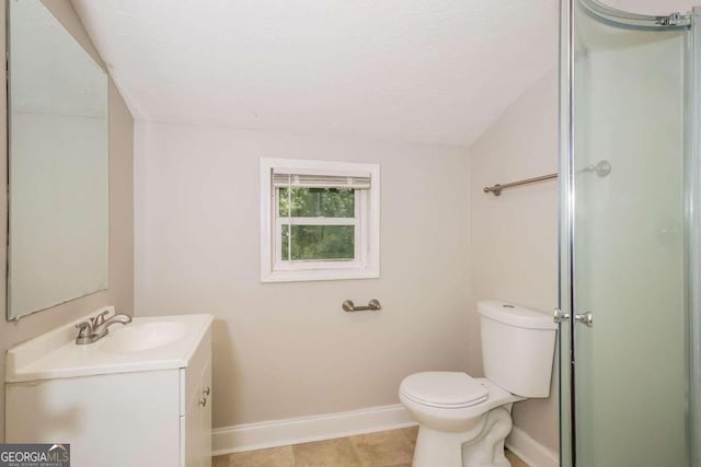 bathroom featuring a textured ceiling, vanity, tile patterned flooring, toilet, and lofted ceiling