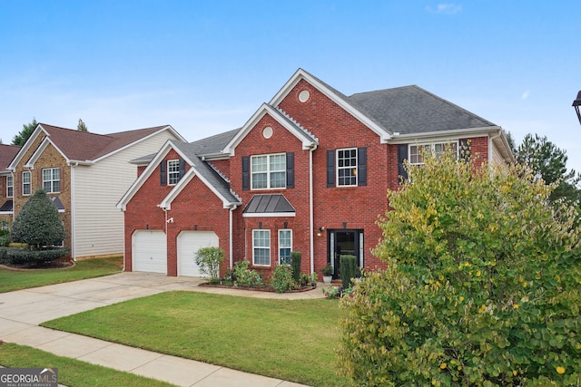 view of front facade featuring a front yard and a garage