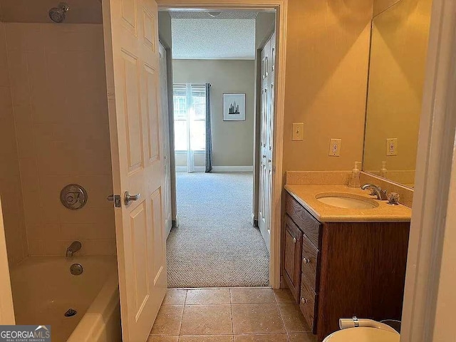 bathroom featuring vanity, a textured ceiling, shower / tub combination, and tile patterned floors