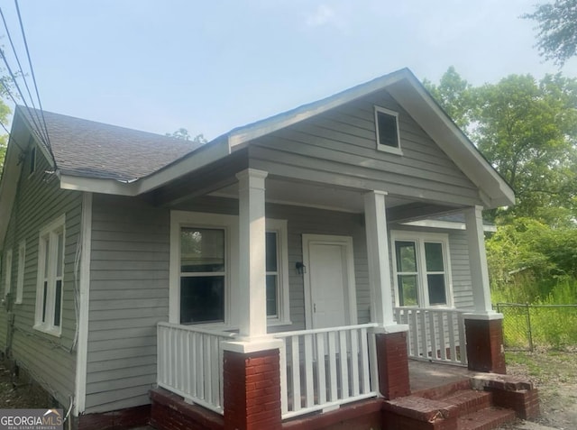 view of property exterior featuring a porch