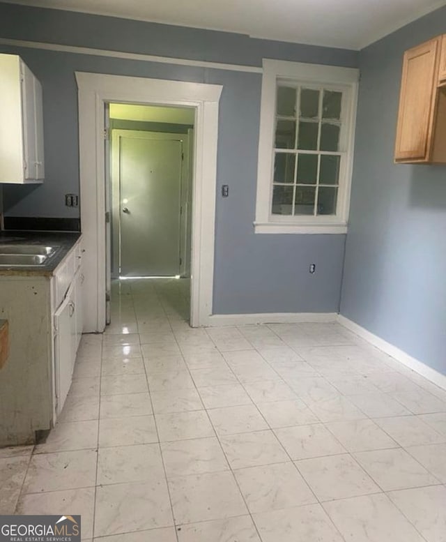 kitchen with sink and light brown cabinets