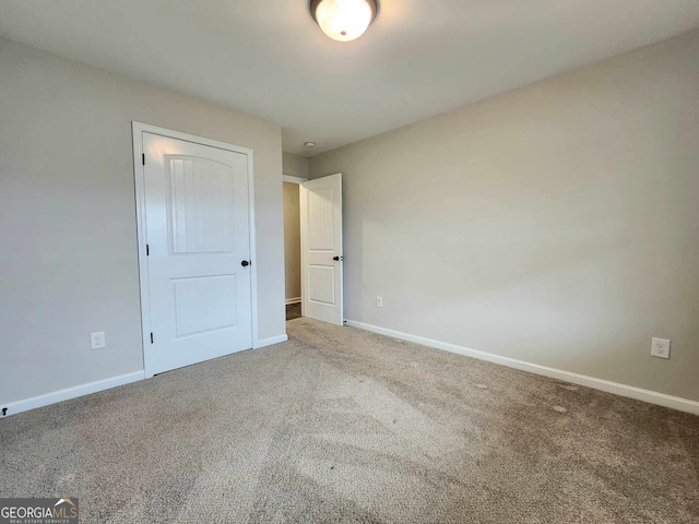 unfurnished room with carpet floors