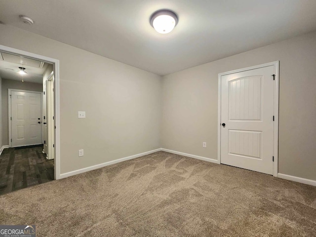 empty room with dark carpet