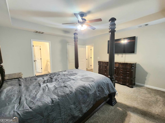 bedroom with light carpet, connected bathroom, and ceiling fan