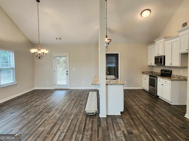 kitchen featuring appliances with stainless steel finishes, dark hardwood / wood-style floors, white cabinetry, and hanging light fixtures