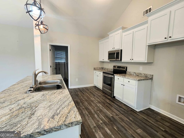 kitchen with stainless steel appliances, sink, dark hardwood / wood-style floors, and white cabinets