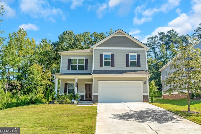 view of front of house with a garage, a front lawn, and a porch