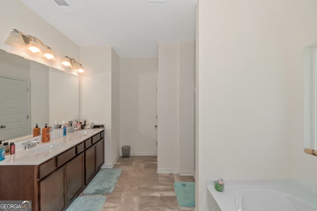 bathroom featuring a tub to relax in and vanity