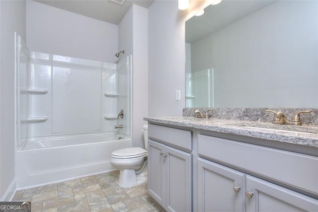 full bathroom with bathing tub / shower combination, vanity, and toilet