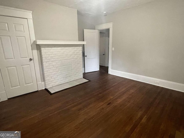 empty room featuring dark hardwood / wood-style floors