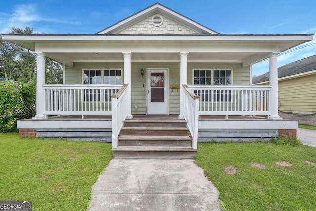 bungalow featuring a porch and a front yard