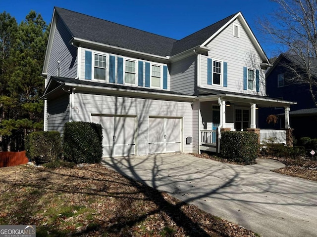 view of front of house with a garage and a porch