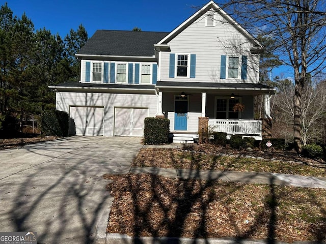 front facade with a garage and a porch