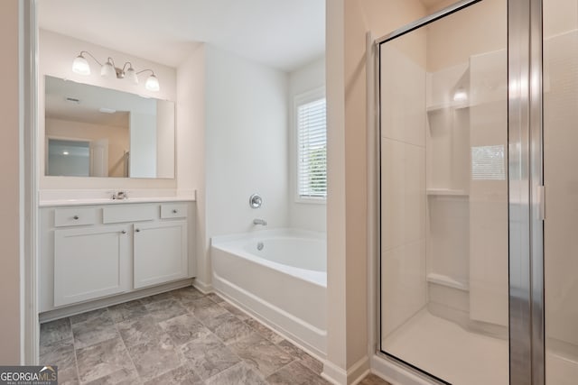 bathroom with separate shower and tub and vanity