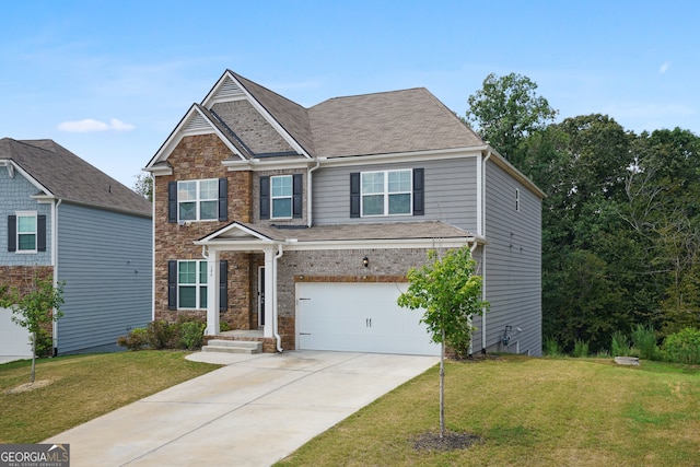 craftsman-style home featuring a garage and a front lawn