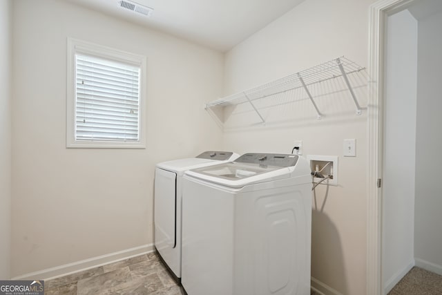 laundry area featuring separate washer and dryer