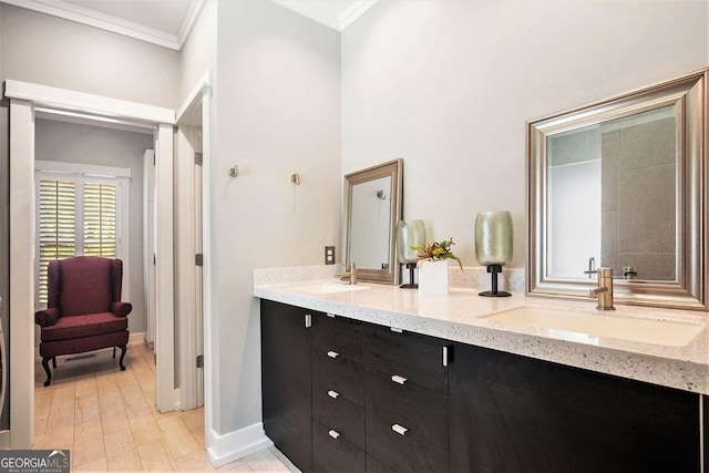 bathroom with vanity, ornamental molding, and wood-type flooring