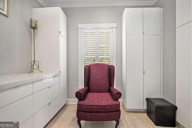 sitting room with ornamental molding