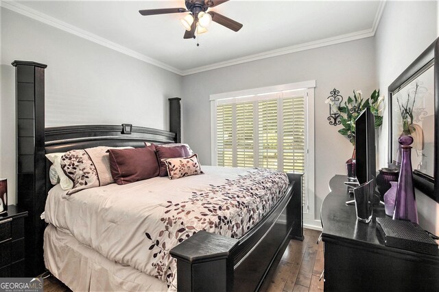 bedroom with ceiling fan, crown molding, and dark hardwood / wood-style flooring