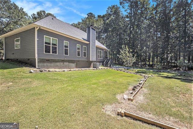103 Royal Way, Mcdonough, GA 30252 - view of property exterior featuring a shingled roof, a yard, a chimney, and crawl space