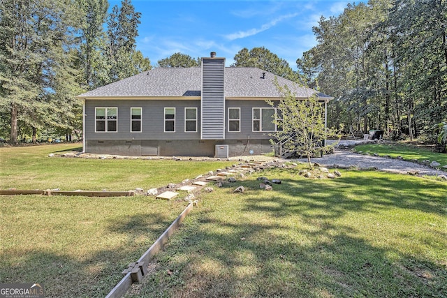 103 Royal Way, Mcdonough, GA 30252 - rear view of house with a lawn, a chimney, and a shingled roof