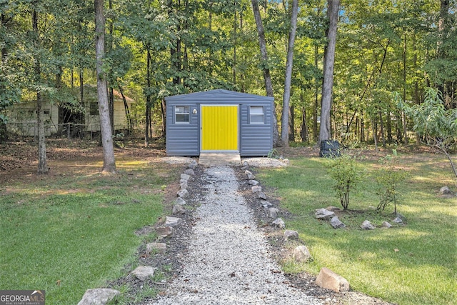 view of outdoor structure with a yard