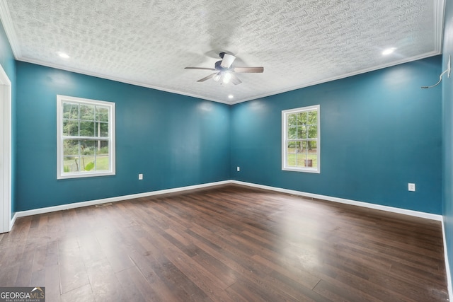 unfurnished room featuring ceiling fan, dark hardwood / wood-style floors, a textured ceiling, and a healthy amount of sunlight