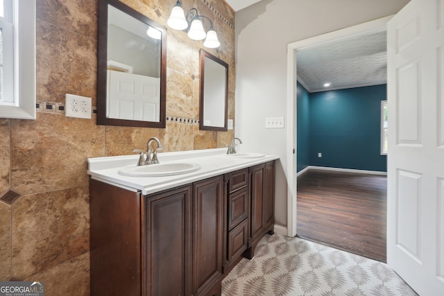 bathroom featuring a textured ceiling, vanity, and hardwood / wood-style flooring