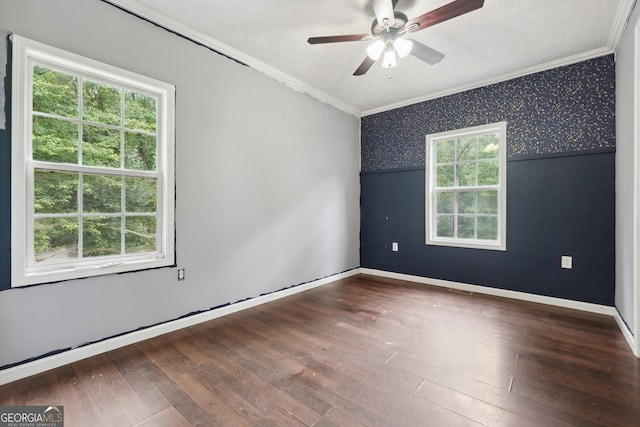 empty room with ceiling fan, hardwood / wood-style flooring, crown molding, and a healthy amount of sunlight