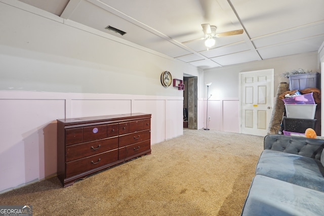 interior space with ceiling fan