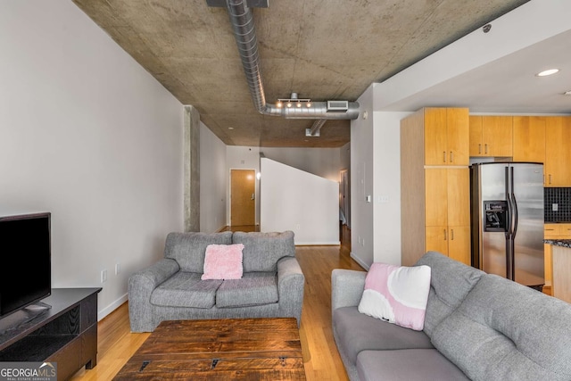 living room with light hardwood / wood-style floors