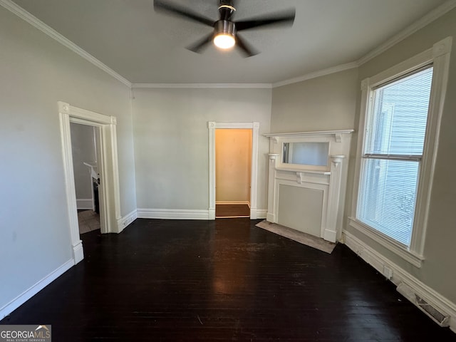 empty room featuring crown molding, ceiling fan, and dark hardwood / wood-style floors