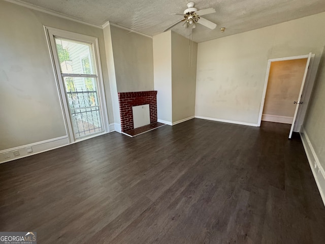 unfurnished living room featuring a textured ceiling, dark wood-type flooring, ceiling fan, and a fireplace