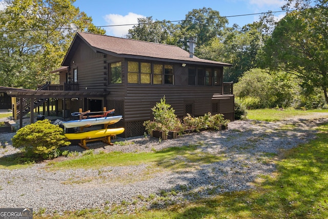 view of side of property with a deck