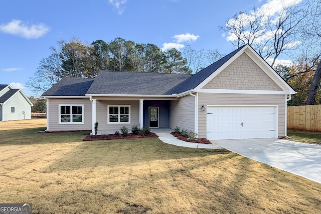 ranch-style home featuring a front yard and a garage