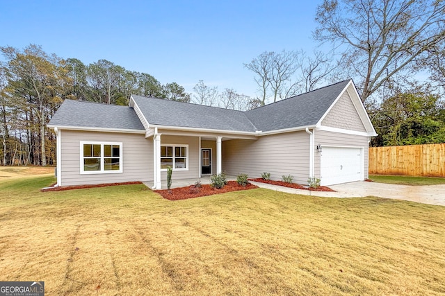 single story home with a front lawn, covered porch, and a garage