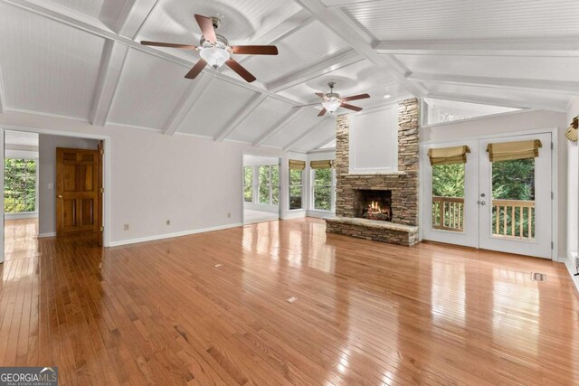 5775 Lakeshore Dr, Buford, GA 30518 - unfurnished living room featuring a ceiling fan, light wood-type flooring, and plenty of natural light