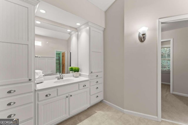 5775 Lakeshore Dr, Buford, GA 30518 - bathroom featuring baseboards, vanity, and recessed lighting