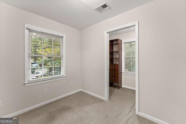 empty room with light colored carpet