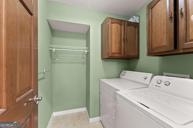 5775 Lakeshore Dr, Buford, GA 30518 - clothes washing area with cabinet space, separate washer and dryer, baseboards, and light tile patterned floors