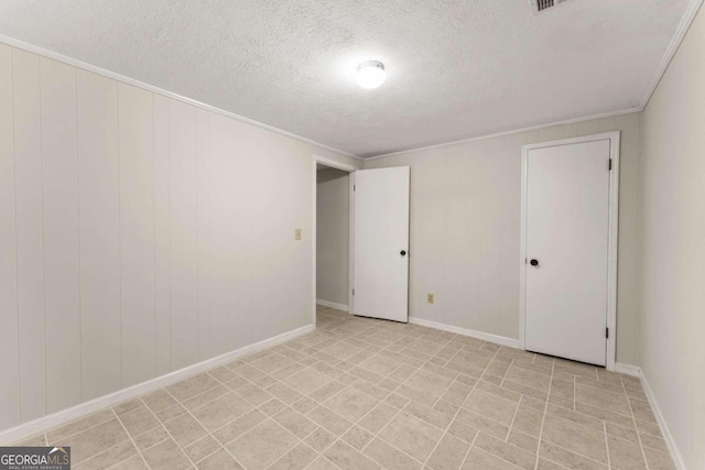 5775 Lakeshore Dr, Buford, GA 30518 - empty room featuring a textured ceiling, crown molding, and baseboards