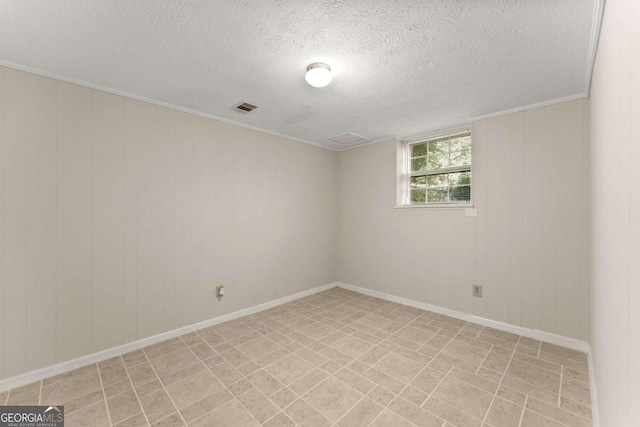 unfurnished room with a textured ceiling