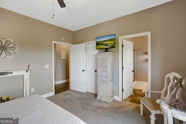 bedroom featuring ceiling fan and light carpet