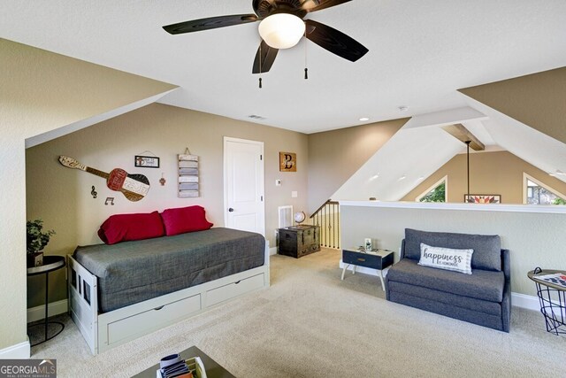 carpeted bedroom with lofted ceiling with beams and ceiling fan