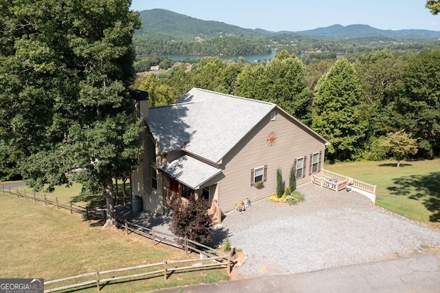 aerial view featuring a water and mountain view