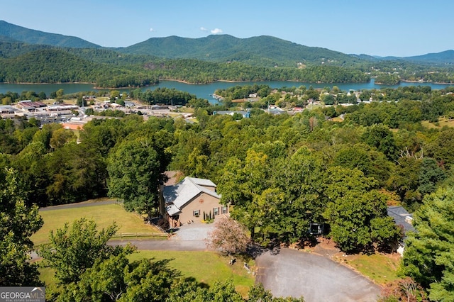 bird's eye view with a water and mountain view