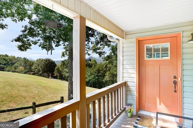 doorway to property featuring a yard