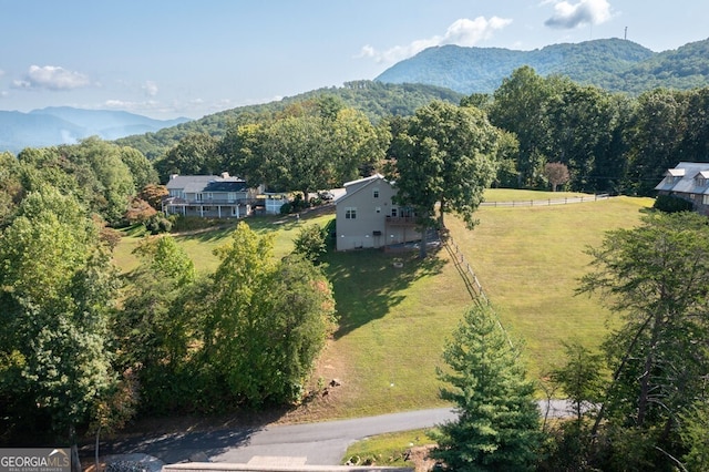 birds eye view of property with a mountain view