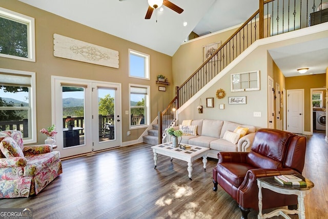 living room featuring high vaulted ceiling, a wealth of natural light, and dark hardwood / wood-style flooring